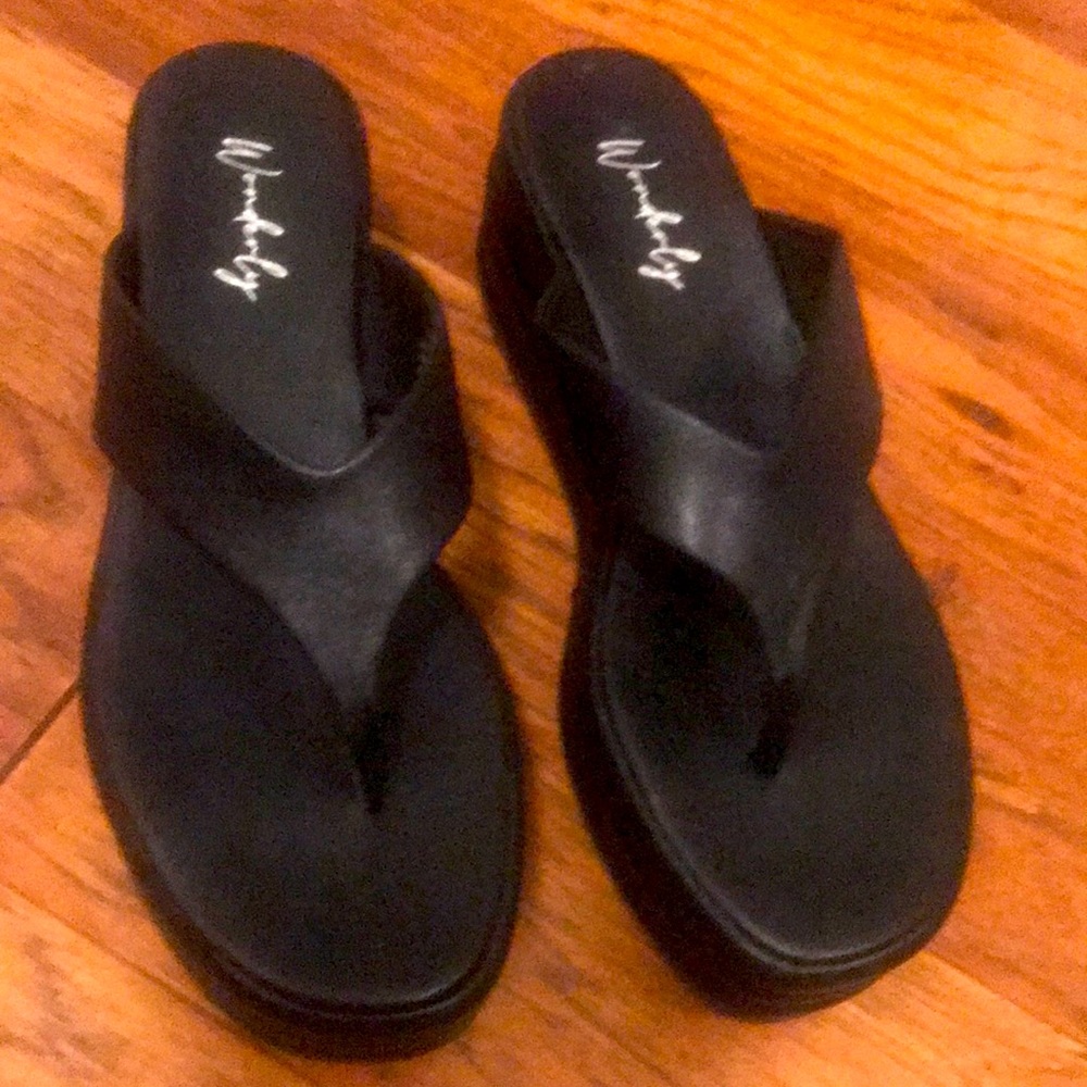 Black platform flip flops.